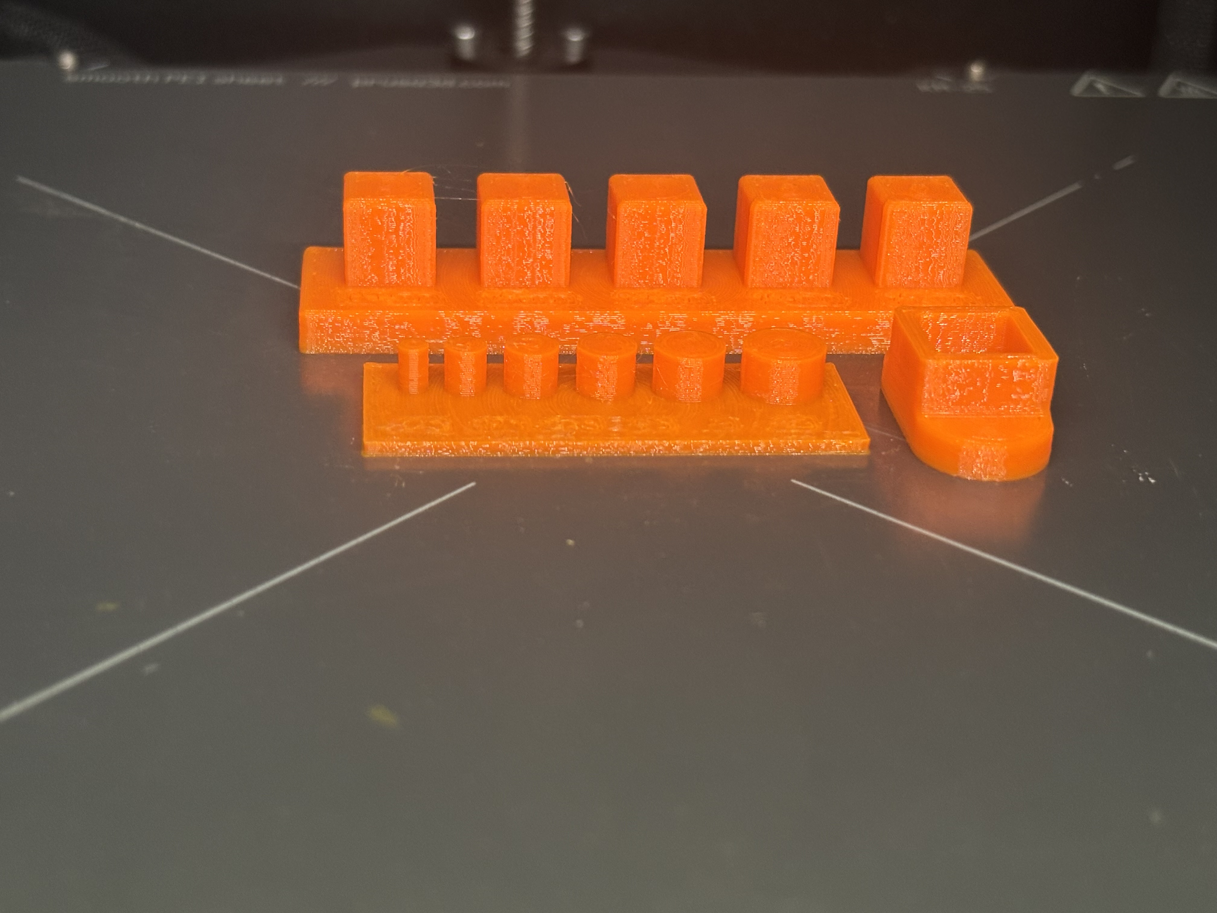 Finished peg plate and socket sitting on the print bed